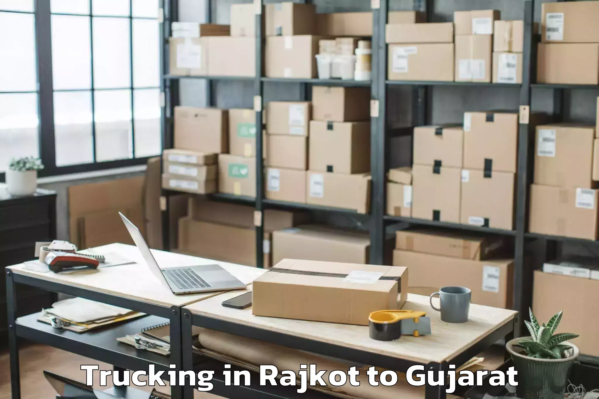 Hassle-Free Rajkot to Uka Tarsadia University Bardol Trucking